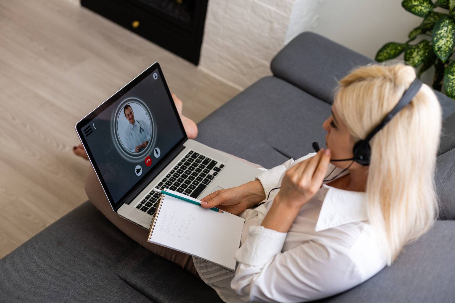 ill woman during web consultation with doctor sitting front computer 1 scaled