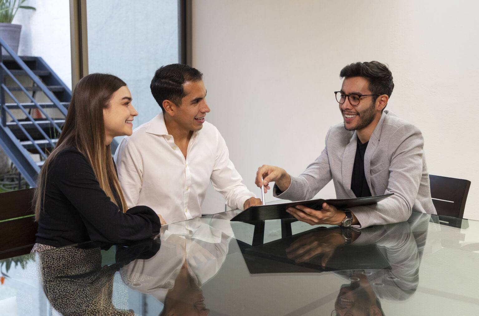 medium-shot-couple-talking-real-estate-agent